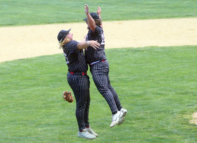 Hall's Joel Koch and teammate Payton Dye chest bump after winning the Class 2A Regional game against Chillicothe on Saturday, May 18, 2024 at Kirby Park in Spring Valley.