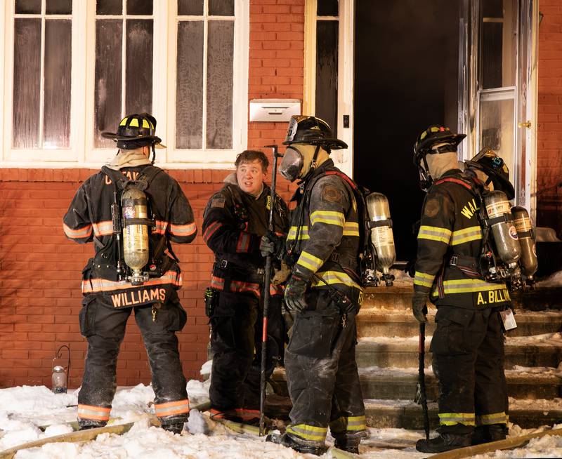 Firefighters work on extinguishing a fire Sunday, Jan. 14, 2023, in South Ottawa.