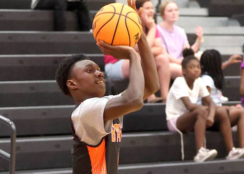 DeKalb’s Marquise Bolden shoots a three pointer during their summer game against Elk Grove Tuesday, June 18, 2024, at DeKalb High School.