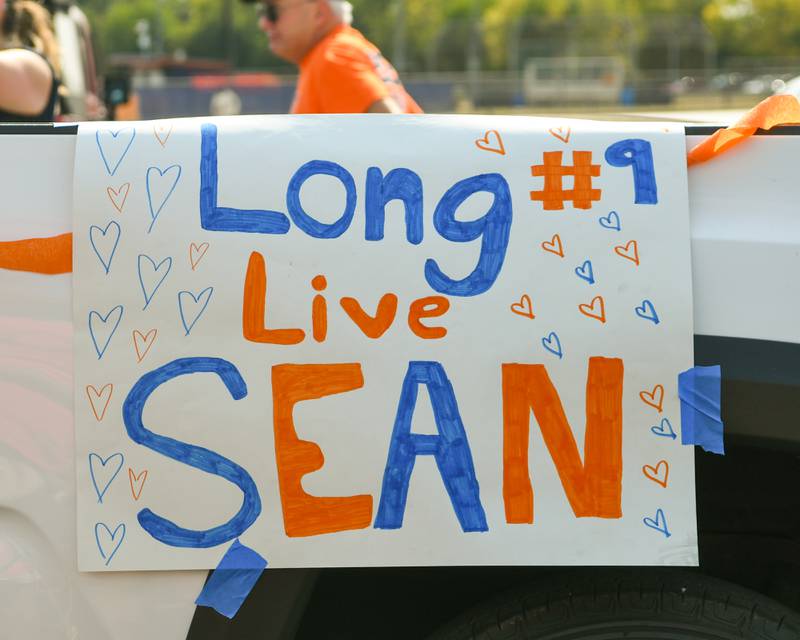 A sign reads Long Live Sean is placed on the volleyball float on Sunday Sept. 15, 2024, during the Oswego High School homecoming parade.