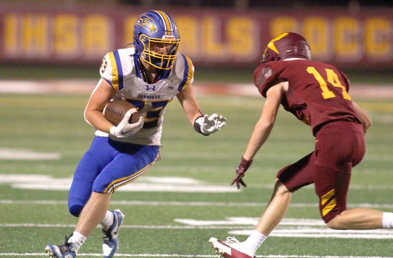 Johnsburg’s Trey Russell looks for an opening in varsity football action on Friday, Sept. 13, 2024, at Richmond-Burton High School in Richmond.