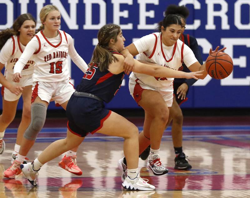 Huntley’s Madison Diaz beats South Elgin’s Madison Hunt to the ball on Tuesday, Nov. 21, 2023, during a basketball game in the Dundee-Crown High School Girls Thanksgiving Tournament in Carpentersville.