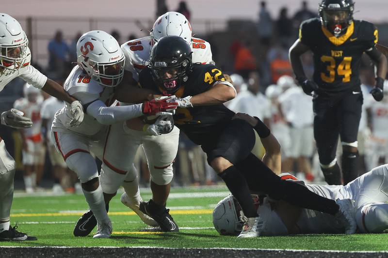 Joliet West’s Gavin Garcia powers his way in for a touchdown against Shepard on Friday, Aug. 25, 2023 in Joliet.