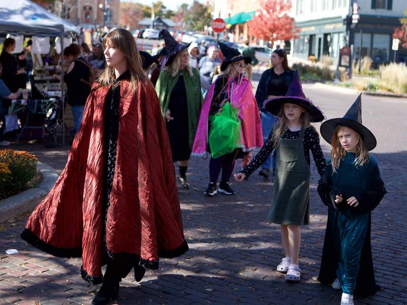 Participants move through the Witches and Wizards of Woodstock event on the Square on Sunday, Oct. 20, 2024 in Woodstock.