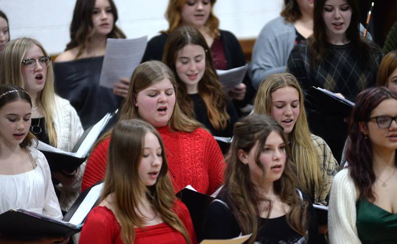 Oregon High School Choir members sing a selection under the direction of  Zach Hall at the OHS Christmas Concert held Sunday, Dec. 17, 2023 at Oregon High School.