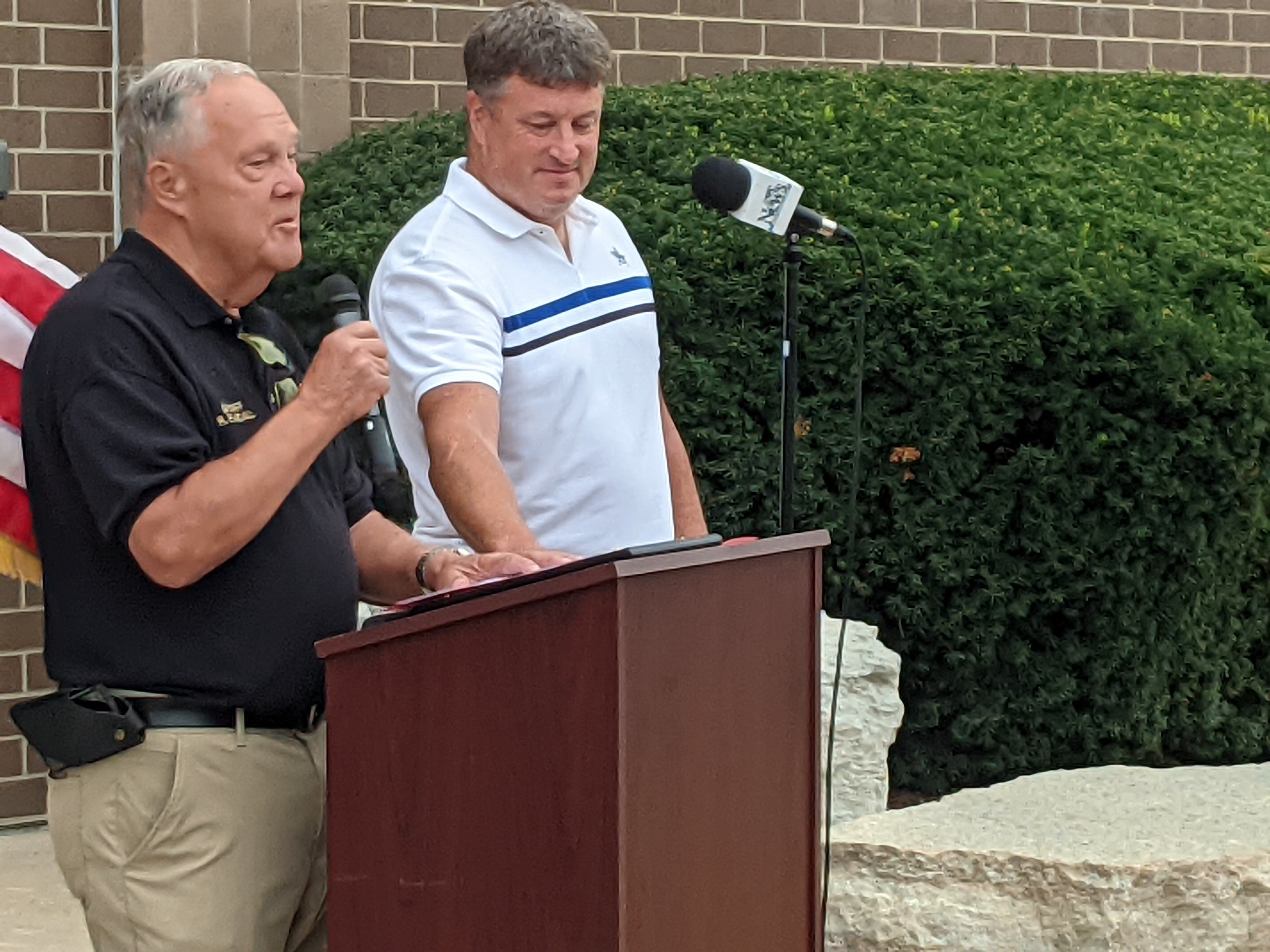 Former Kendall County sheriff Richard Randall, left, speaks during the Aug. 6 dedication ceremony as Kendall County Board Chairman Matt Kellogg, right, looks on.