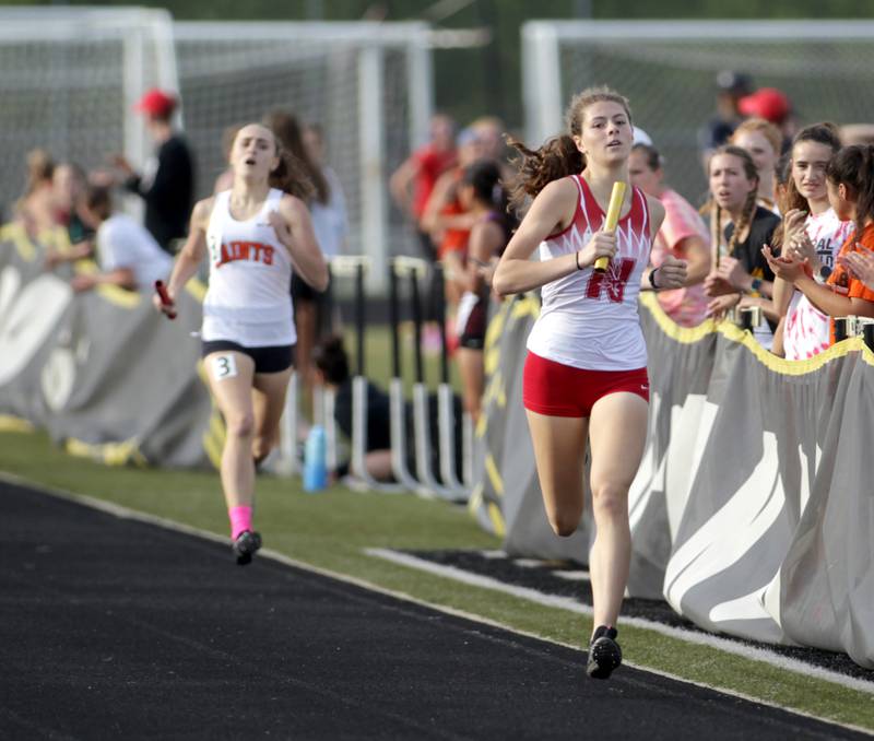 Naperville Central’s Lola Satre-Morales runs the anchor leg to win the 4 x 800-meter relay during the Class 3A Metea Valley girls track and field sectional on Thursday, May 11, 2023.