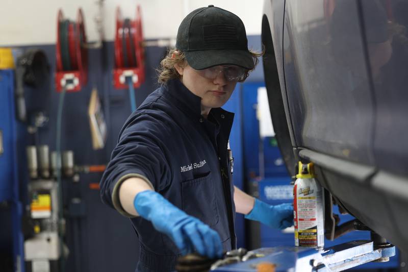 Michael Sullivan works on a vehicle’s brakes during Auto Service IV class at Joliet Junior College on Thursday, Feb. 1, 2024.