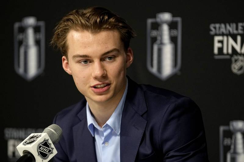 FILE - NHL draft prospect Connor Bedard speaks to the media prior to Game 2 of the NHL hockey Stanley Cup Finals between the Florida Panthers and the Vegas Golden Knights, June 5, 2023, in Las Vegas. Bedard, from British Columbia, is anticipated to be selected by the Chicago Blackhawks with the No. 1 pick in the NHL draft Wednesday, June 28, 2023. (AP Photo/Abbie Parr, File)
