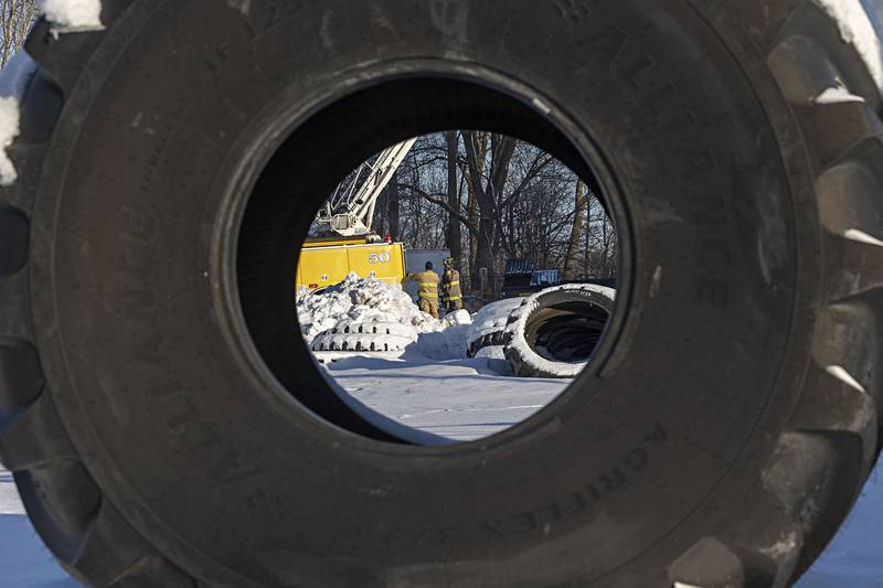 Firefighters work at the scene of a fire at Moore Tires Tuesday, Jan. 16, 2024 in Rock Falls.