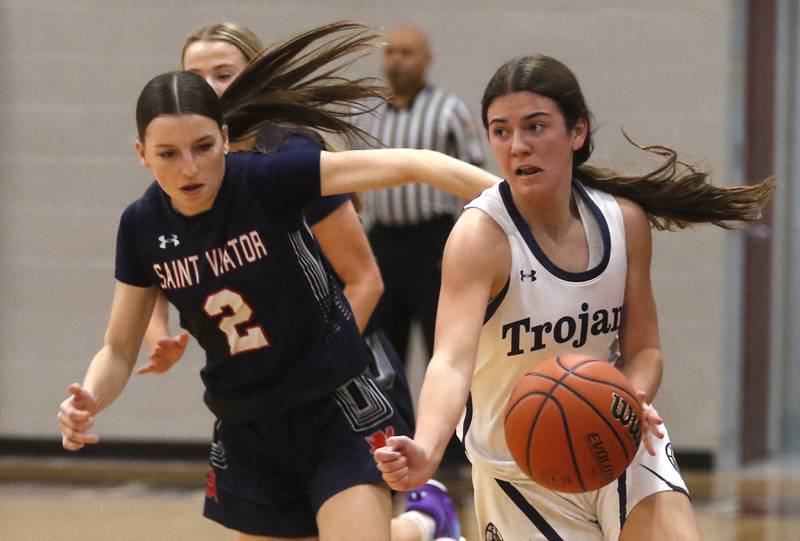 Cary-Grove's Kennedy Manning pushes the ball up the court against St. Viator's Maggie Ratzki during an IHSA Class 3A Antioch Sectional semifinal girls basketball game on Tuesday, Feb. 20, 2024, at Antioch High School.