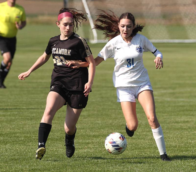 Sycamore's Hannah Raetzke and Woodstock's Alyssa Fetzer go after the ball during their Class 2A regional semifinal game Wednesday, May 15, 2024, at Kaneland High School in Maple Park.