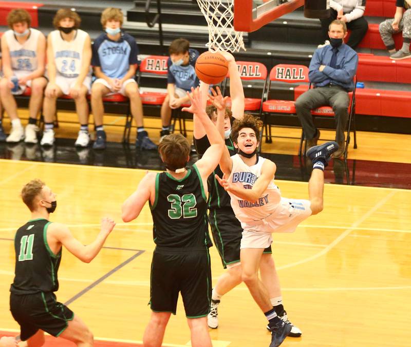 Bureau Valley's Cooper Balensiefen, (15) squeezes past Rock Fall's Chevy Bates, (32) to score a basket during the 74th annual Colmone Classic tournament on Wednesday Dec. 8, 2021 at Hall High School in Spring Valley.