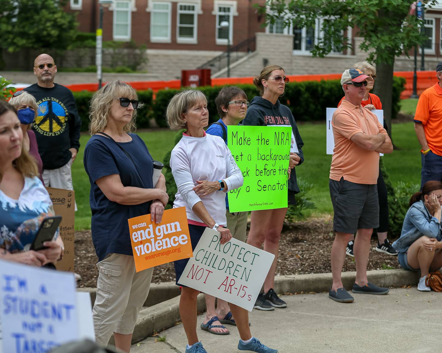 Participants listen to Michael Stroud speak during the March for Lives rally and march. June 11, 2022