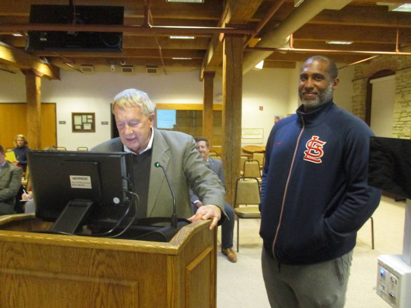 Mayor Jeff Schielke reads a proclamation honoring Keenan Miller, right, who has resigned from the Batavia City Council, during the Nov. 6, 2023 council meeting.