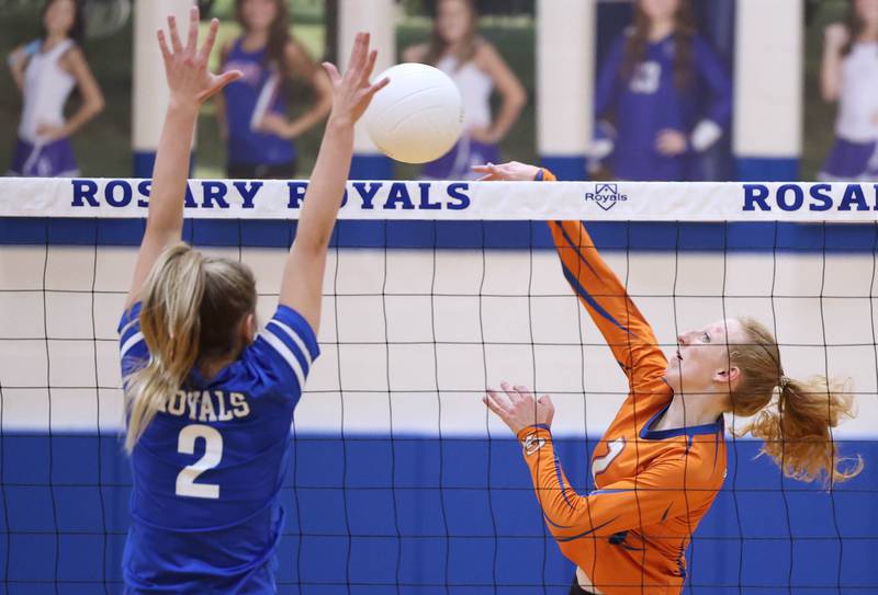 Genoa-Kingston's Kailey Kline tries to spike the ball past Rosary's Lily Caruso during their Regional semifinal match Tuesday, Oct. 25, 2022, at Rosary High School in Aurora