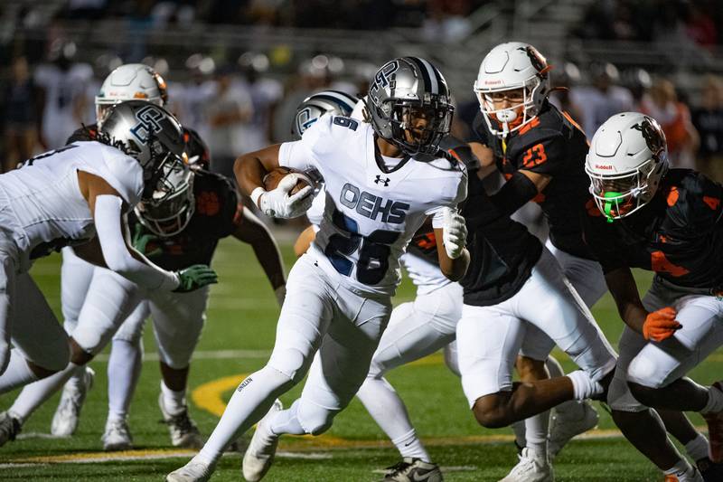 Oswego East's Ty'Rel Thomas breaks through the Plainfield East defense during a game on Thursday Sept. 12, 2024 at Plainfield East High School