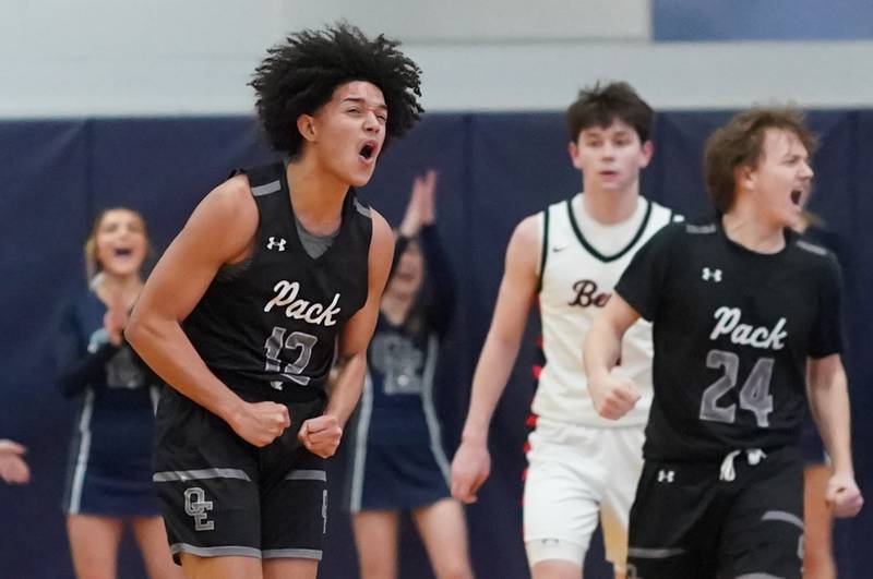 Oswego East's Drey Wisdom (12) reacts after scoring a basket against Benet during a Class 4A Oswego East regional final basketball game at Oswego East High School on Friday, Feb 23, 2024.