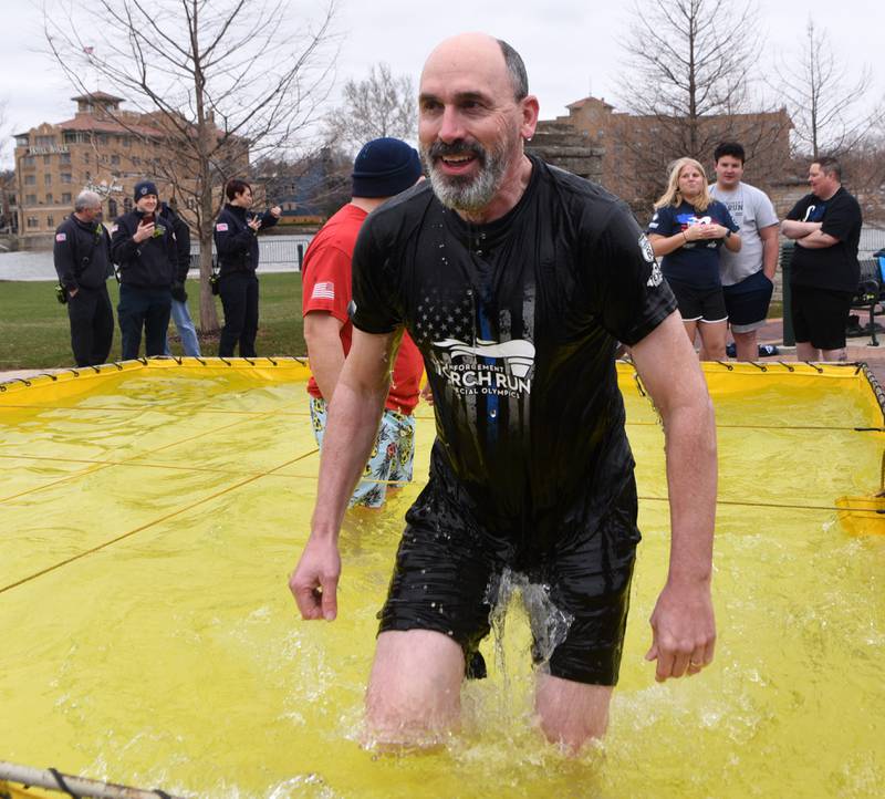 St. Charles Deputy Police Chief Erik Mahan exits the portable tank during a cold-weather plunge event to benefit Special Olympics in St. Charles Saturday, March 26, 2022.