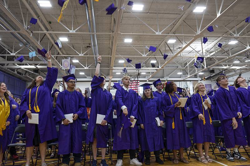 Hats go airborne as the Dixon High School class of 2024 is announced as graduates Sunday, May 26, 2024.