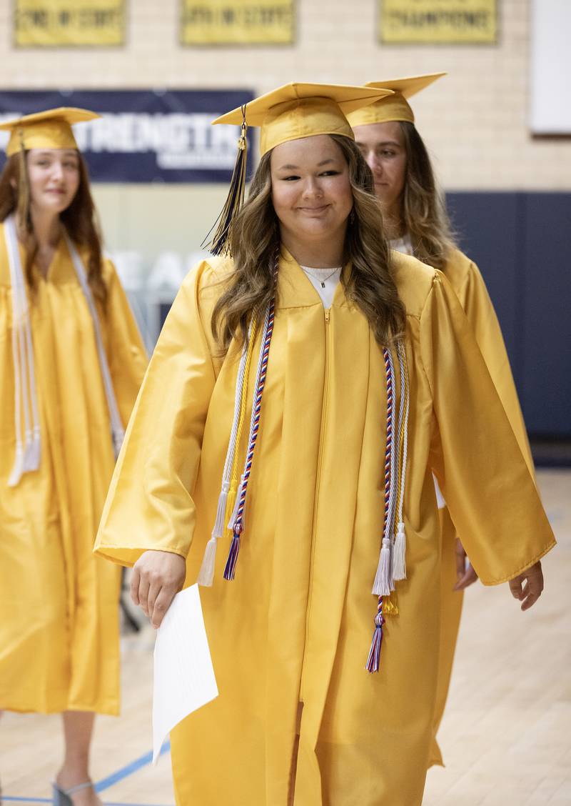 Class of 2024 Valedictorian Jenna Gamons leads her fellow Marquette Academy High School graduates Sunday, May 26, 2024, into Bader Gymnasium for the commencement ceremony.