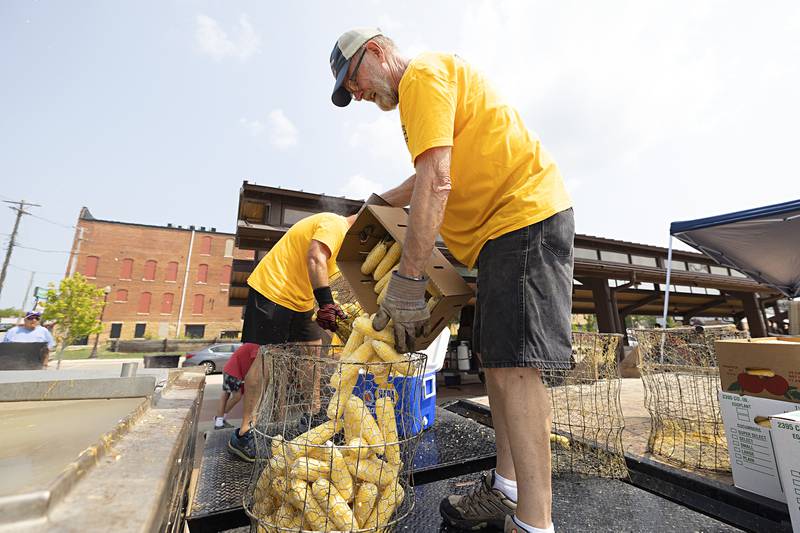 Mike Albers readies another basket of sweet corn Monday, July 24, 2023 for the Rotary Corn Boil.