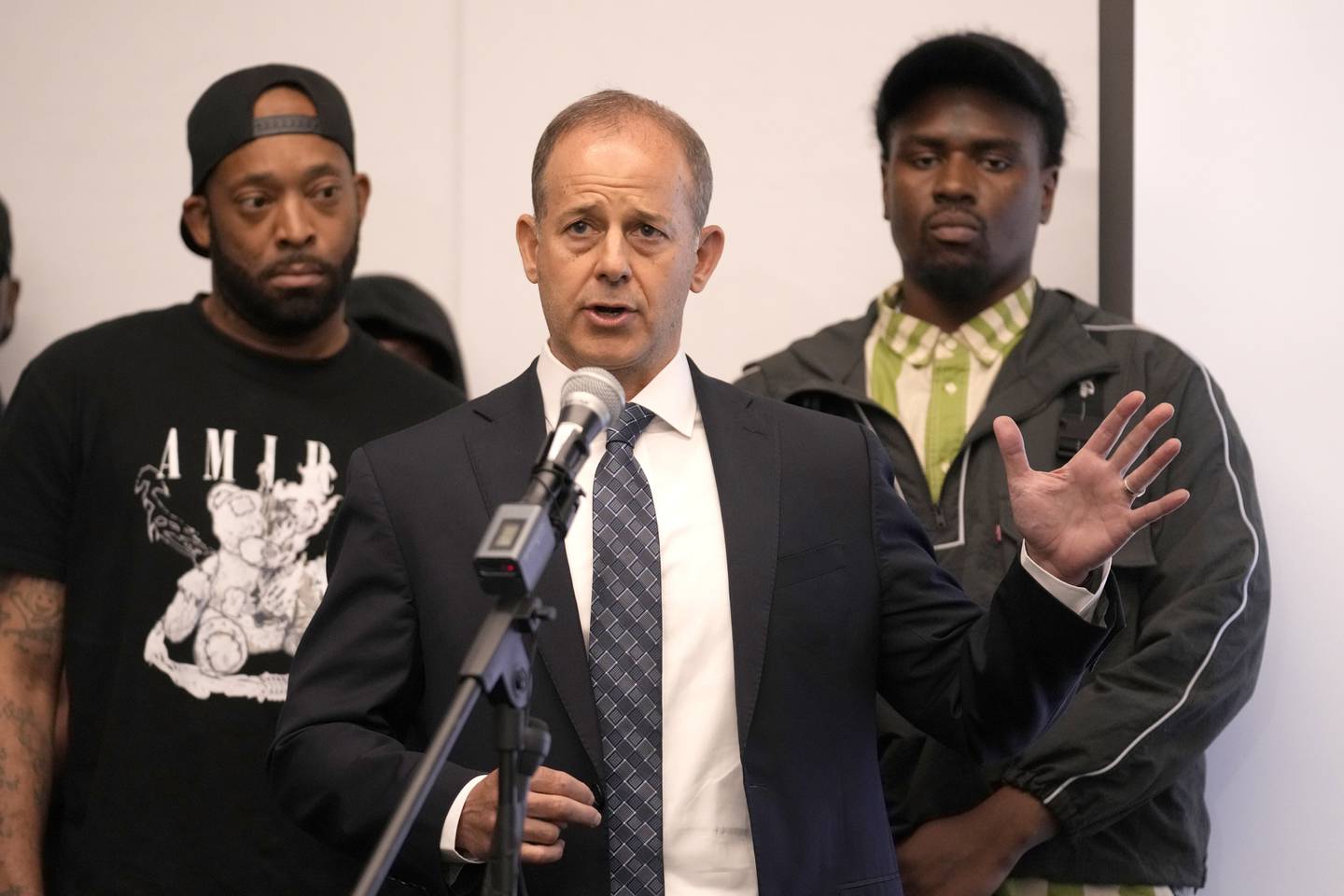 Attorney Jerome Block, center, stands with Donzell, left, and Michael, who allege sexual abuse while in the custody of the Illinois Department of Corrections and Department of Juvenile Justice during a news conference Monday, June 3, 2024, in Chicago. Dozens more former youth inmates filed lawsuits Friday, seeking millions of dollars in damages for sexual abuse they allegedly endured at Illinois detention centers dating back to the late 1990s.