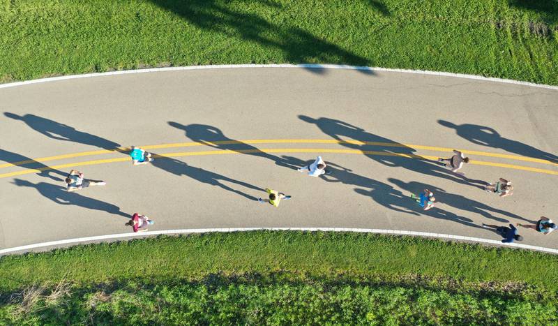 Shadows or runners can be seen from above in this aerial photo during the Starved Rock Marathon and Half Marathon on Saturday, May 11, 2024 at Starved Rock State Park.