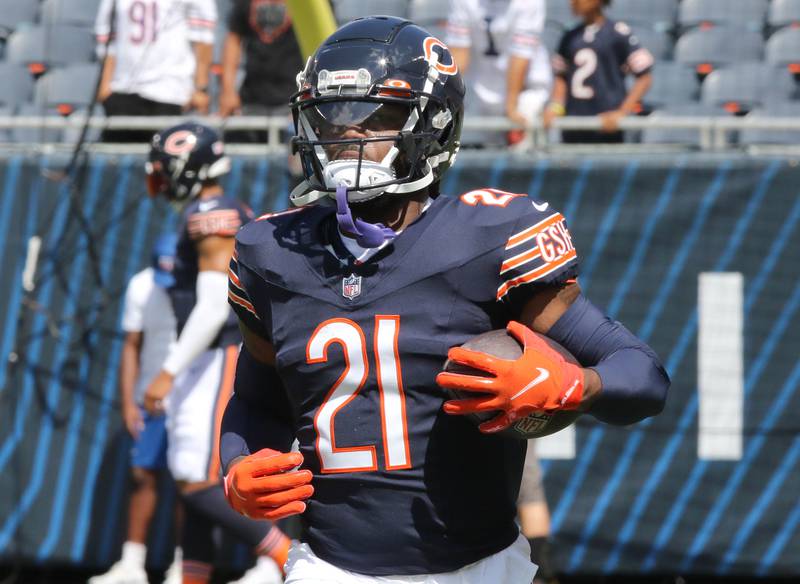 Chicago Bears running back D'Onta Foreman gets loose before their preseason game against the Tennessee Titans Saturday, Aug. 12, 2023, at Soldier Field in Chicago.