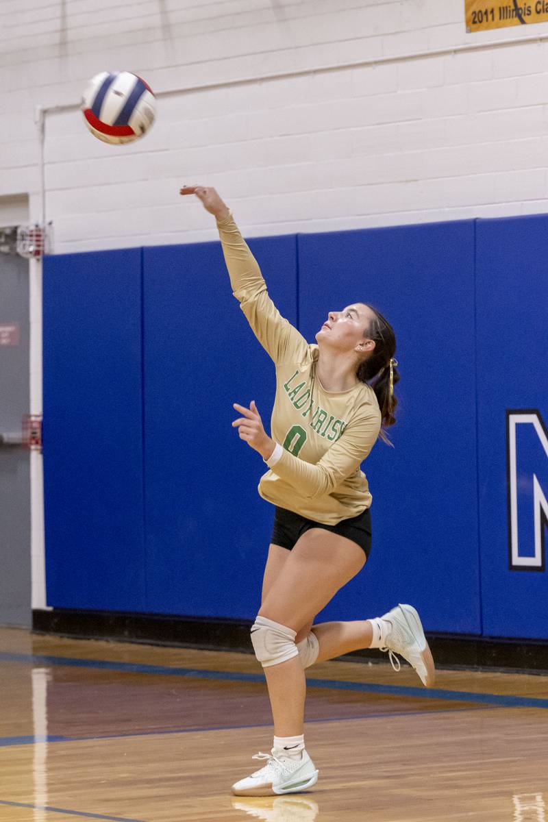 Seneca libero Alyssa Zellers serves the ball over the net in a match against Newark High School on September 9, 2024.