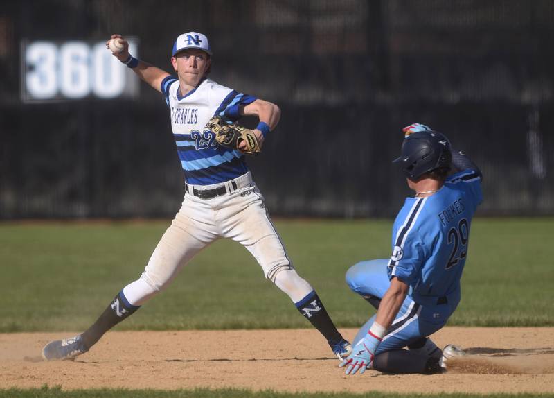 St. Charles North's Jackson Spring (22) forces out Lake Park's Jacob Folkes at second during Friday’s baseball game in St. Charles.