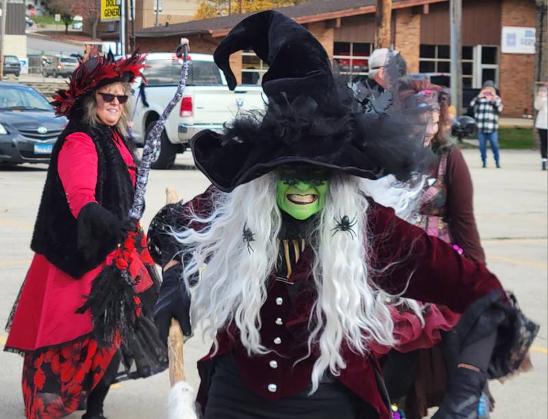 A member of the Hocus Pocus Hags focuses on a member of the crowd at Saturday's La Salle Halloween Celebration.