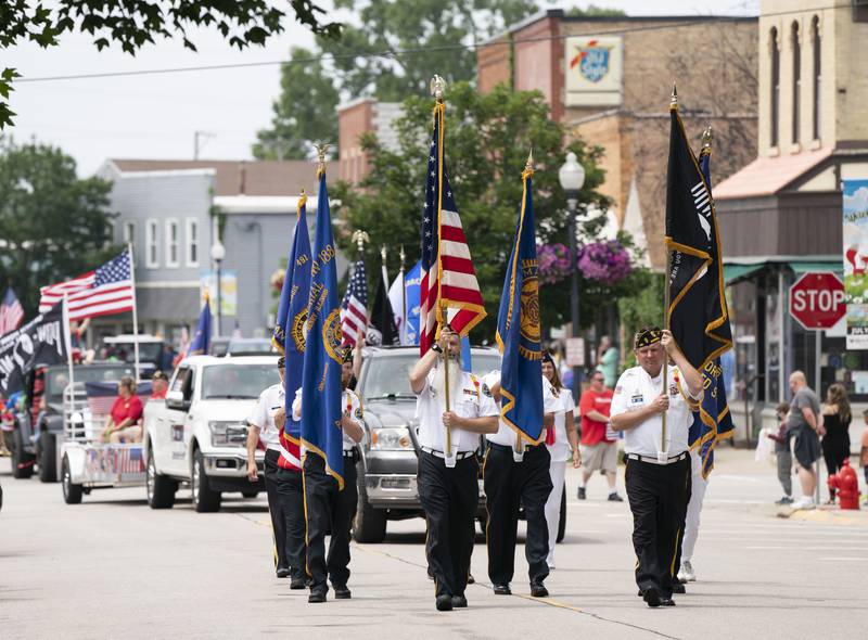 The combined color guard from McHenry American Legion Post 491 and McHenry VFW Post 4600 start the parade along Main Street during the McHenry Fiesta Days Parade on Sunday, July 17, 2022 in downtown McHenry. The festival ran from July 7-17. Ryan Rayburn for Shaw Local