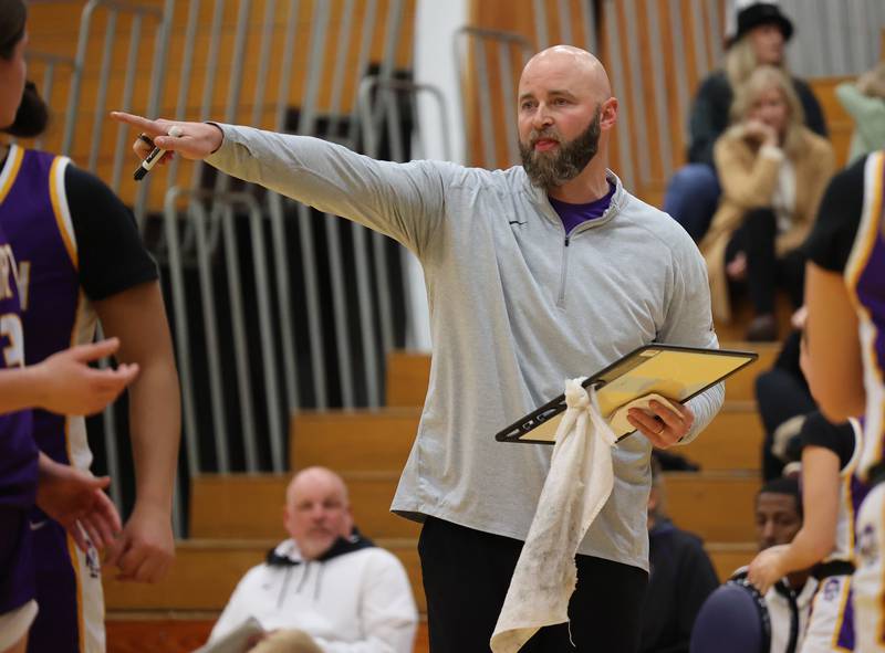 Downers Grove North’s head coach Stephan Bolt gives the team some last minute advice against Lyons Township during the girls varsity basketball game on Tuesday, Jan. 16, 2024 in La Grange, IL.