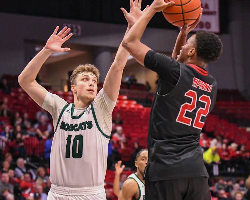 Northern Illinois’s Steven Tipton (22) shoots the ball while being defended by Ohio’s Aidan Hadaway (10) during the game on Saturday Feb. 24, 2024, held at The Convocation Center in DeKalb.