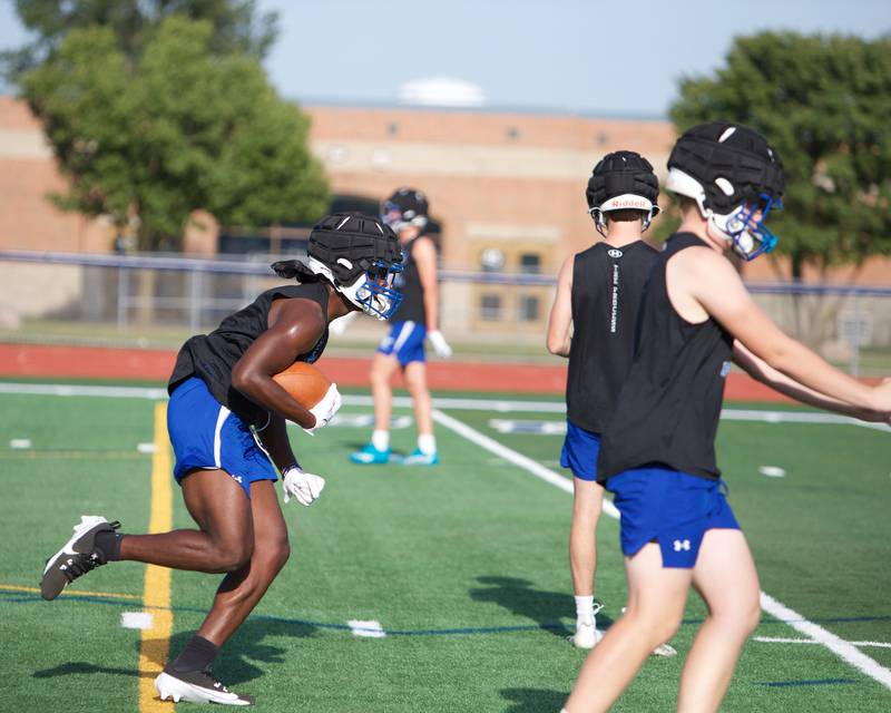 St. Charles North' runs plays during the first day of practice on Monday Aug.12,2024 in St. Charles.