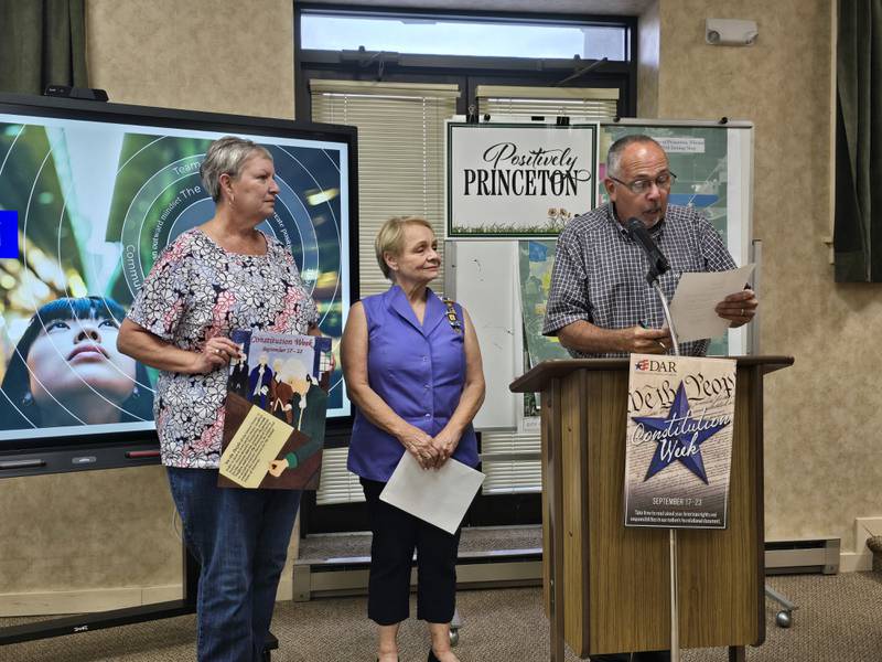 Princeton Mayor Ray Mabry reads a proclamation for Constitution Day on Monday, Sept. 16, 2024, as Daughters of the American Revolution Gayle Little (left) and Nancy Gartner listen during the Princeton City Council meeting.