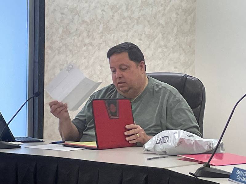 New Oglesby Commissioner Don Finley reviews meeting materials before the Oglesby City Council meeting on Monday, June 17, 2024. Finley, a former Oglesby mayor, was appointed June 3 to the seat vacated by Terry Eutis and sworn in the next day.