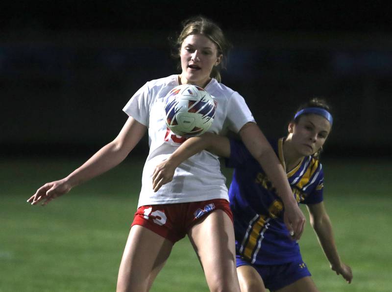 Marian Central'a Elizabeth Drwila battles with Johnsburg's Elizabeth Smith for control of the ball during the IHSA Class 1A Marengo Regional championship soccer match on Tuesday, May 14, 2024, at Marengo High School.