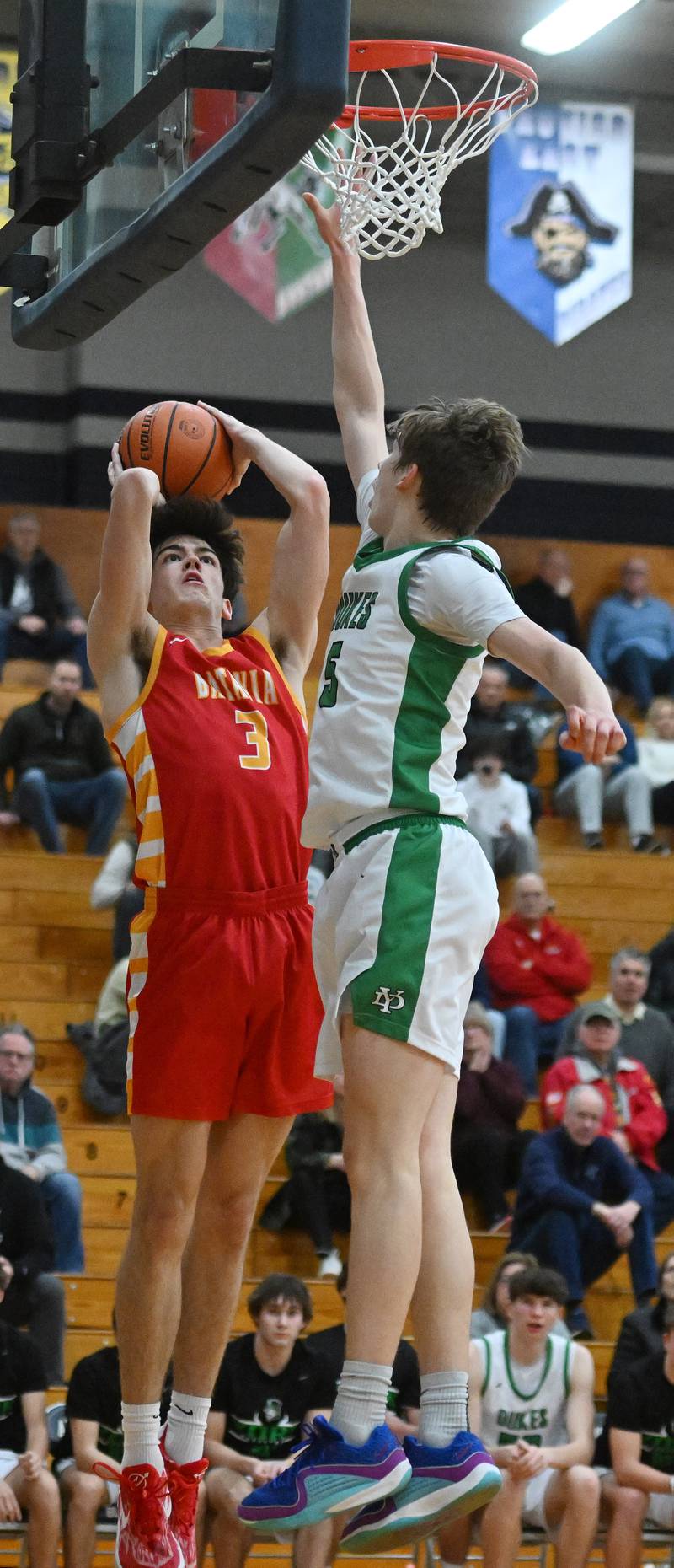 Batavia’s Kyle Porter, left, shoots as York’s Kyle Waltz defends during the Addison Trail Class 4A boys basketball sectional semifinal on Wednesday, Feb. 28, 2024 in Addison.