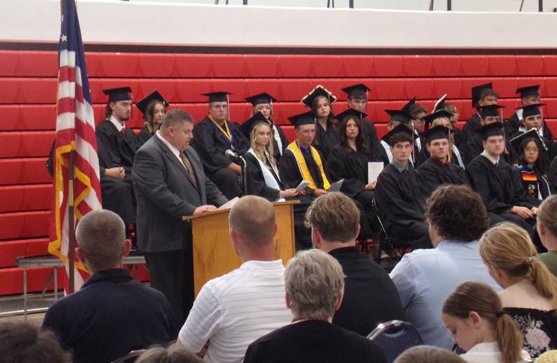 Woodland Superintendent Ryan McGuckin presents the Class of 2024 during the school's graduation ceremony.