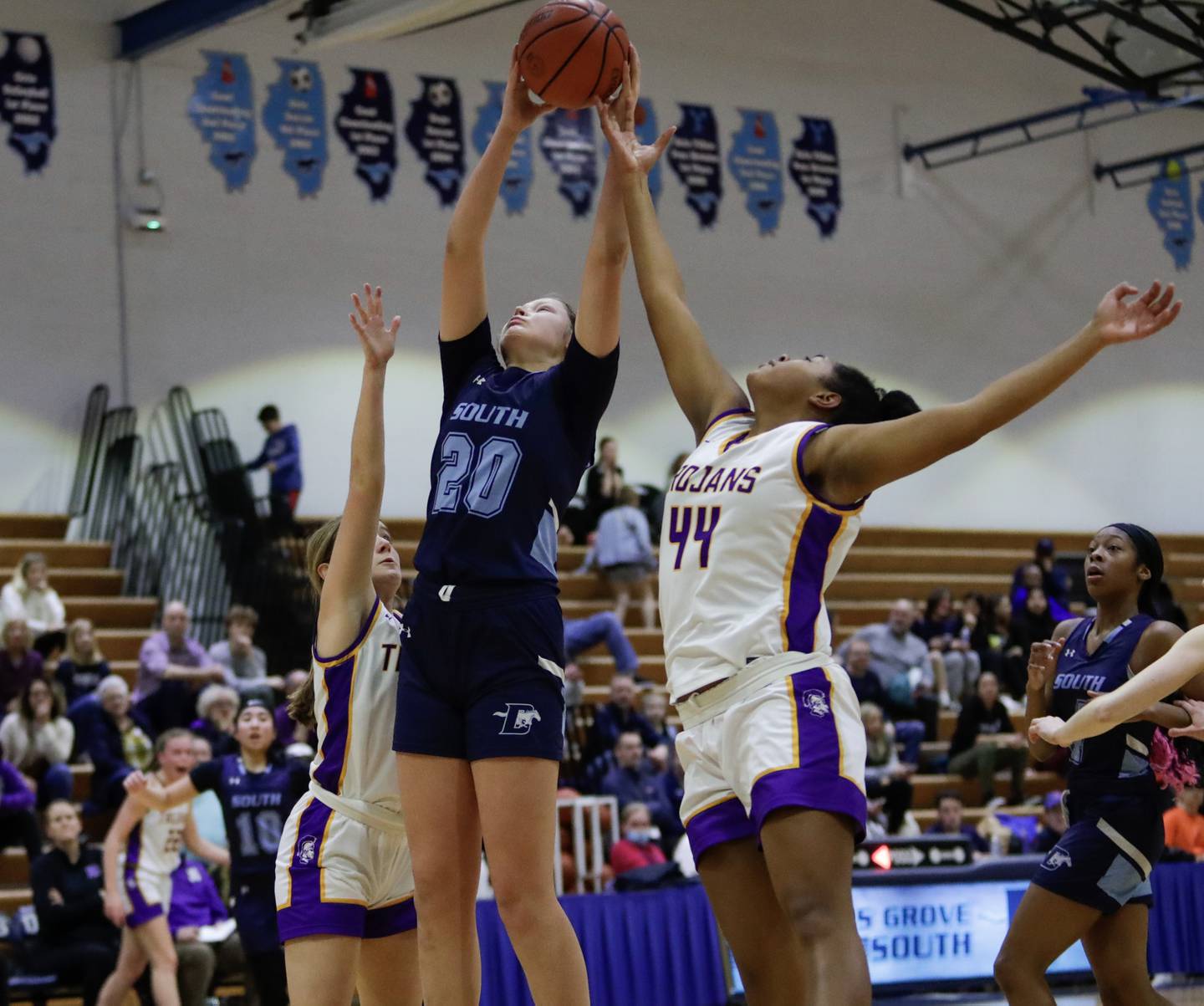 Downers Grove South’s Megan Ganschow (20) grabs a rebound against Downers Grove North’s Lizzy Murphy (44) during a Class 4A Downers Grove South Regional semifinal in Downers Grove, Ill. on Monday, Feb. 13, 2023.