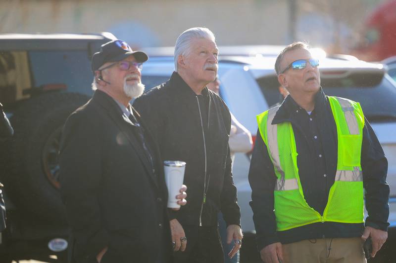 Will County State’s Attorney James Glasgow (center) watches the beginning of the external demolition of the old Will County Courthouse on Friday, Feb. 9th 2024 in Joliet.