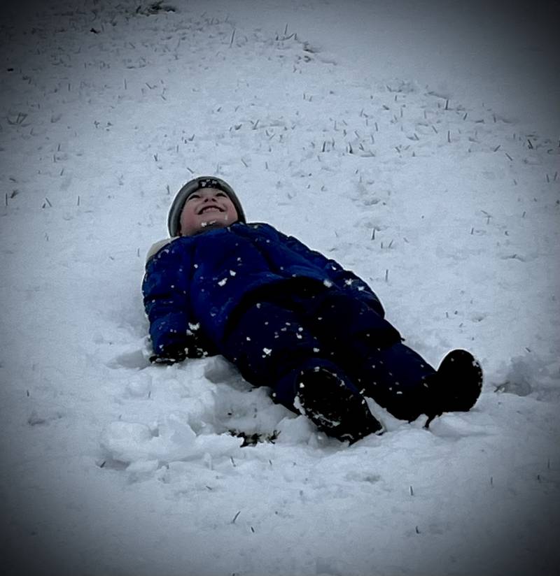 Henry Merdian makes his first snow angel of 2024 on Tuesday, Jan. 9, 2024, in Sterling.