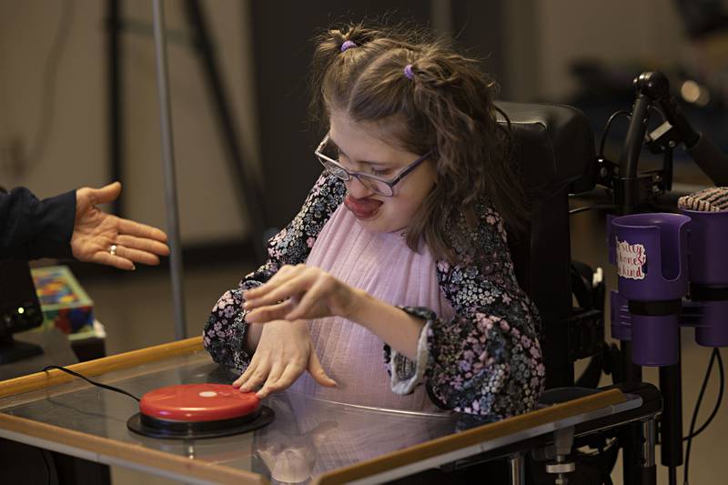 Addy Weidman, an eighth grader at Reagan Middle School, work with a Big Mac Switch to control a smart board Thursday, April 6, 2023 at the school. Weidman uses a variety of technology in her learning.