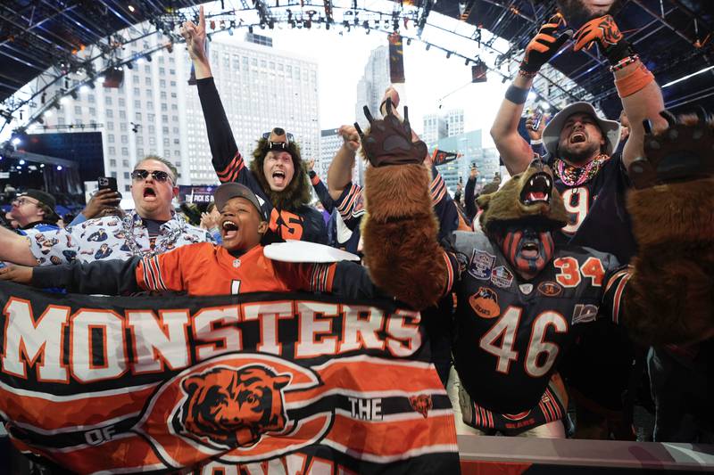 Chicago Bears fans react to Southern California quarterback Caleb Williams being chosen with the first overall pick during the first round of the NFL Draft, April 25, 2024, in Detroit. (AP Photo/Paul Sancya)