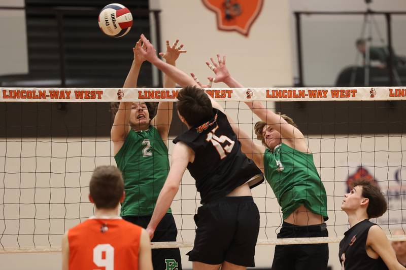 Providence’s Kaden Kaczmarek, left, and Hayden Hill go for the block against Lincoln-Way West on Wednesday, April 3, 2024 in New Lenox.