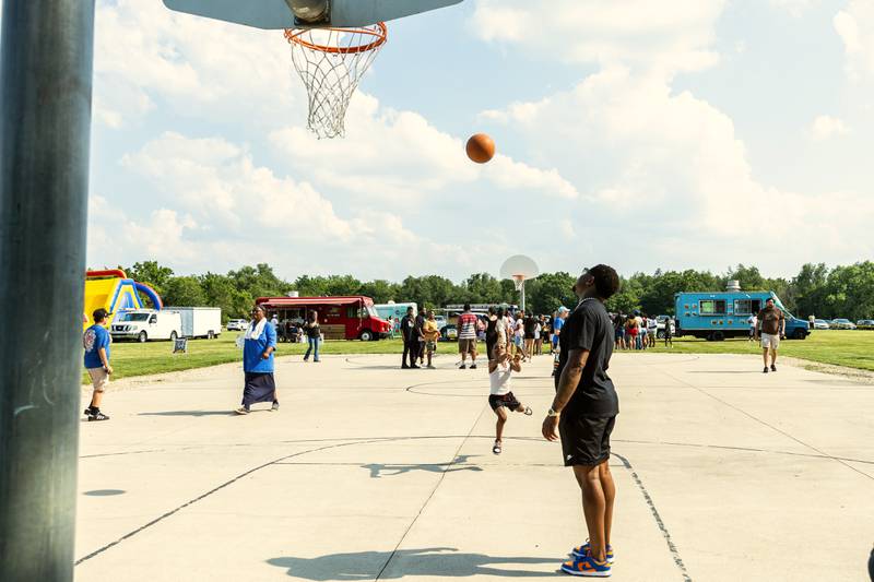 Lockport residents Kaiden and L.J. Jordan shoot hoops during Lockport Township Park District's Juneteenth Celebration at A.F. Hill Park on June 19, 2024.