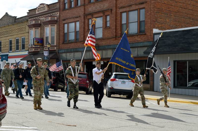 Polo's Color Guard, whose members are from Patrick Fegan American Legion Post No. 83 and Veterans of Foreign Wars Post 8455, walk down Mason Street in the city's Memorial Day parade on Monday, May 27, 2024.