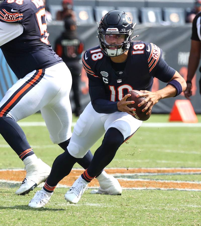 Chicago Bears quarterback Caleb Williams scrambles for yardage during their game against the Tennessee Titans Sunday, Sept. 8, 2024, at Soldier Field in Chicago.